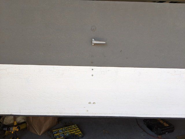 after picture of repaired garage door panel