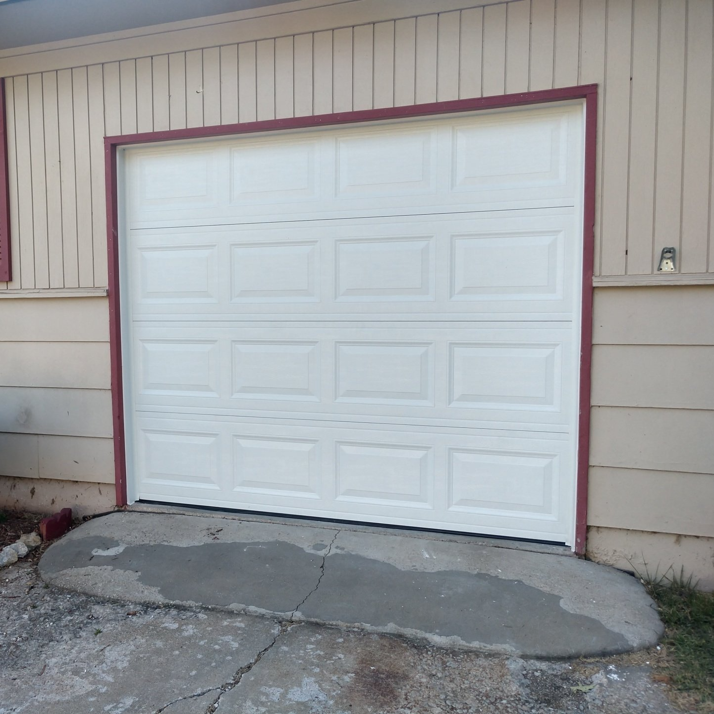 before and after picture of new recessed panel garage door installation