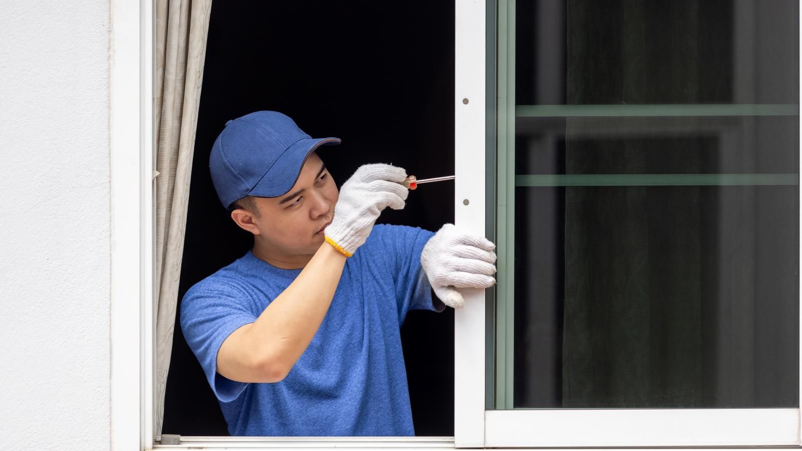 Professional replacing a casement window.