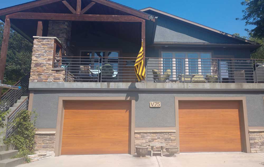 before and after picture of new wood garage door installation