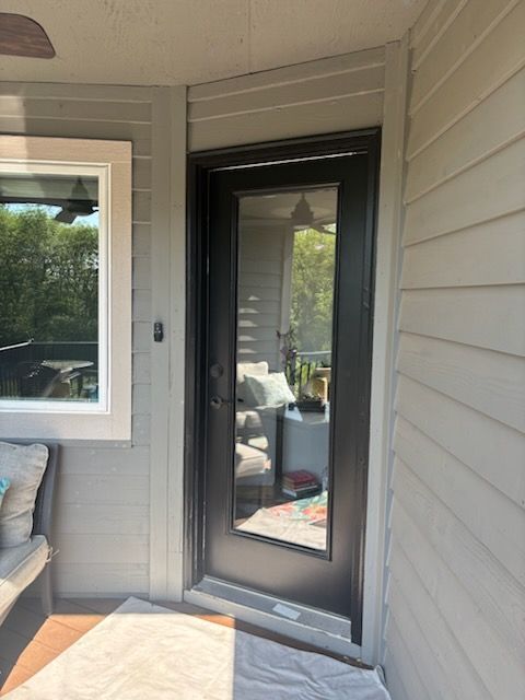 square entry to home with wooden front door