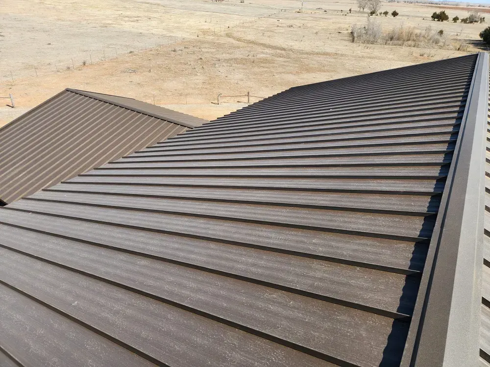 A close up of a brown metal roof on a house.