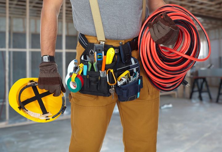 electrician with wires and tools