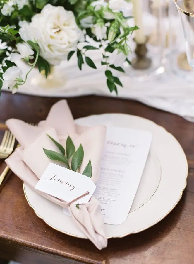 A Plate With a Napkin and a Name Tag on It on a Table