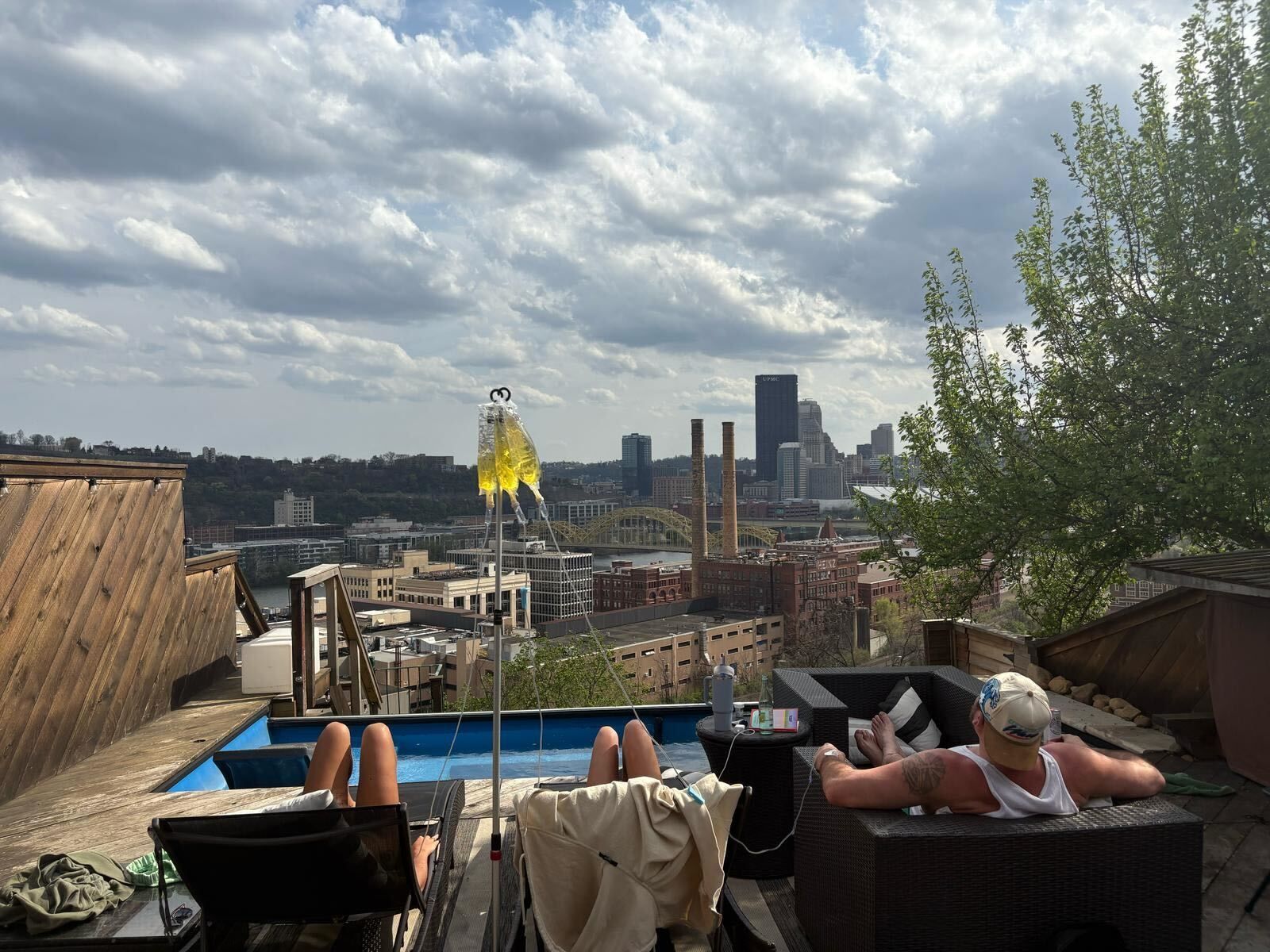 A city skyline with a yellow bridge in the foreground.