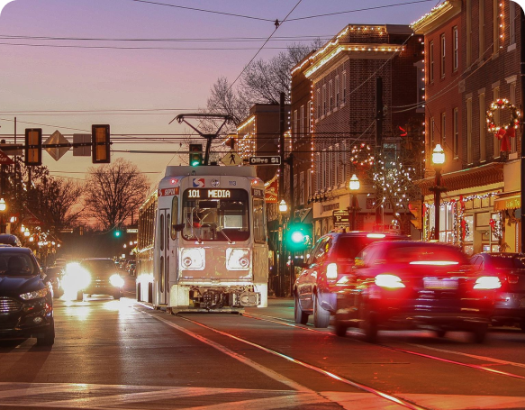 A city skyline with a yellow bridge in the foreground.