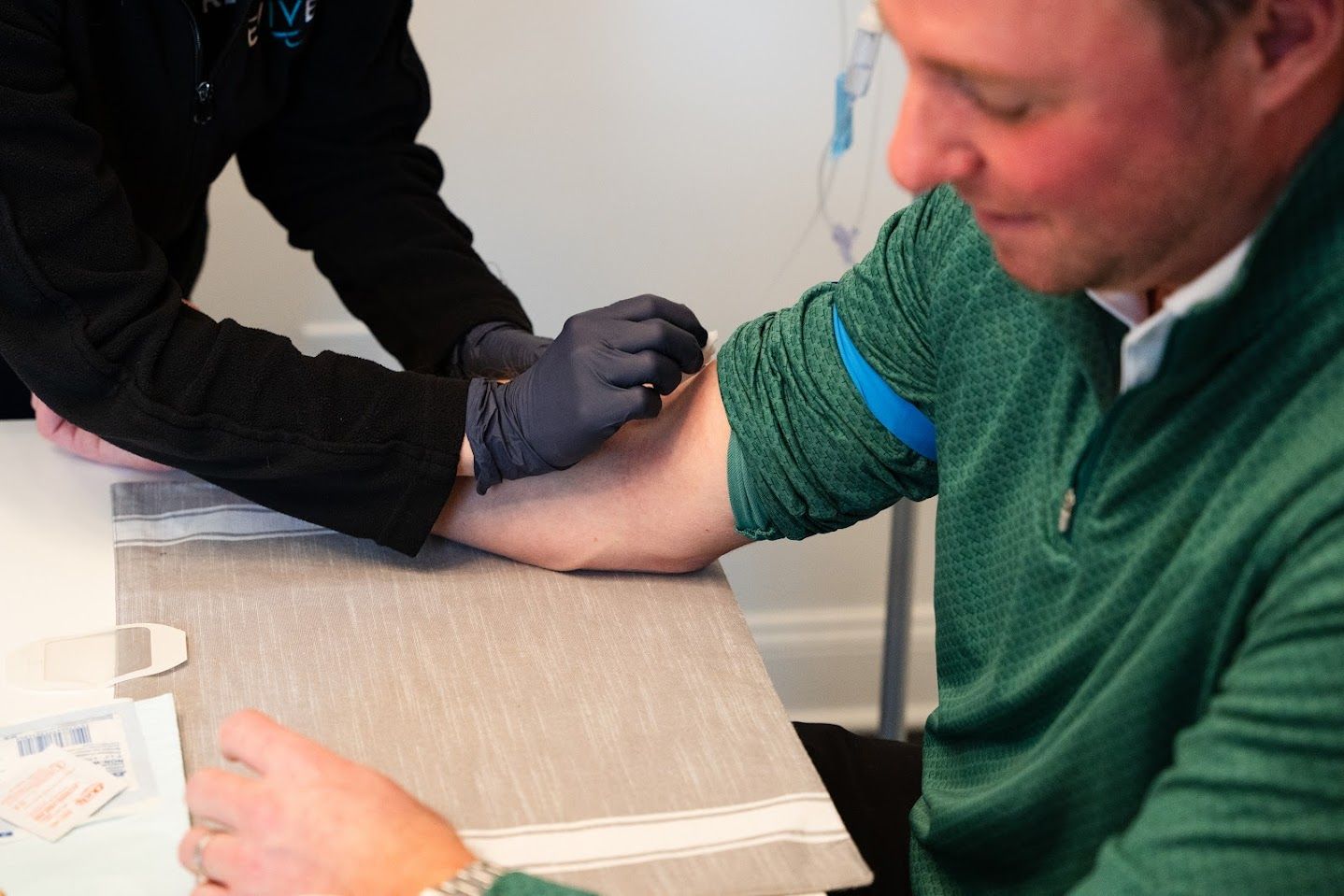 Revive employee preparing  to use IV for  patient
