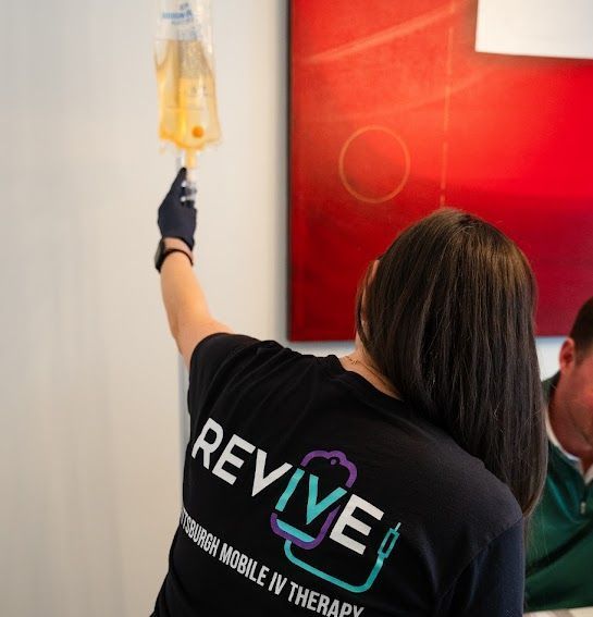 A woman wearing a black shirt that says revive