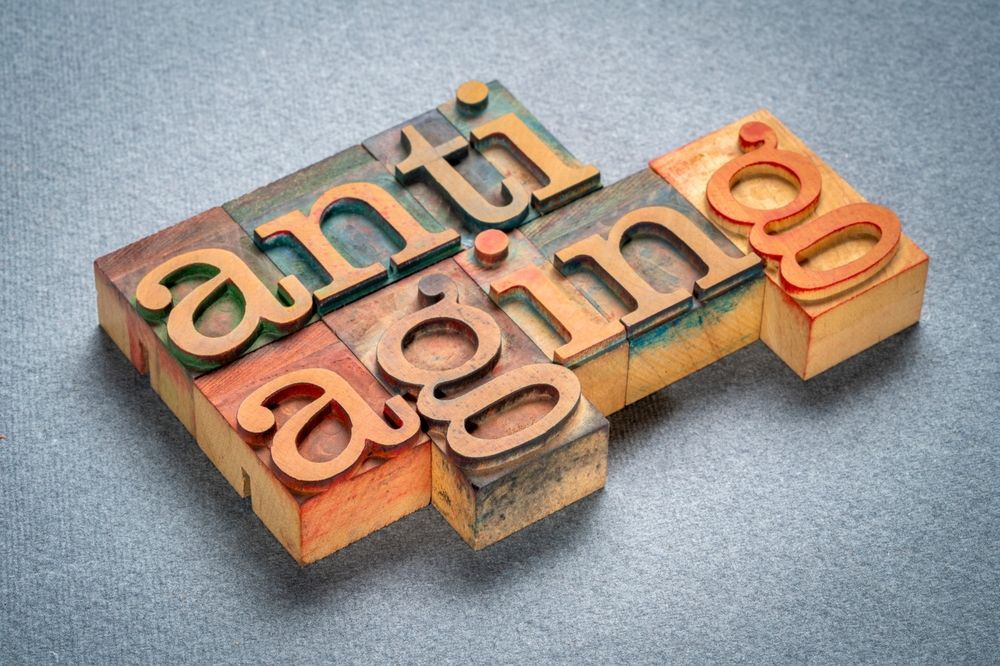 The word anti aging is written in wooden letterpress type.