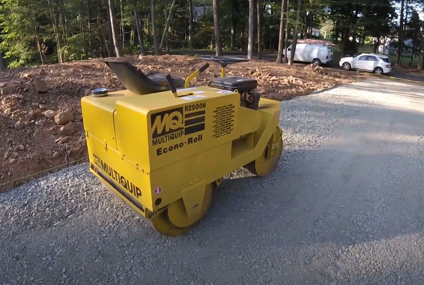 A road roller on a graded driveway before asphalt paving in Lexingotn