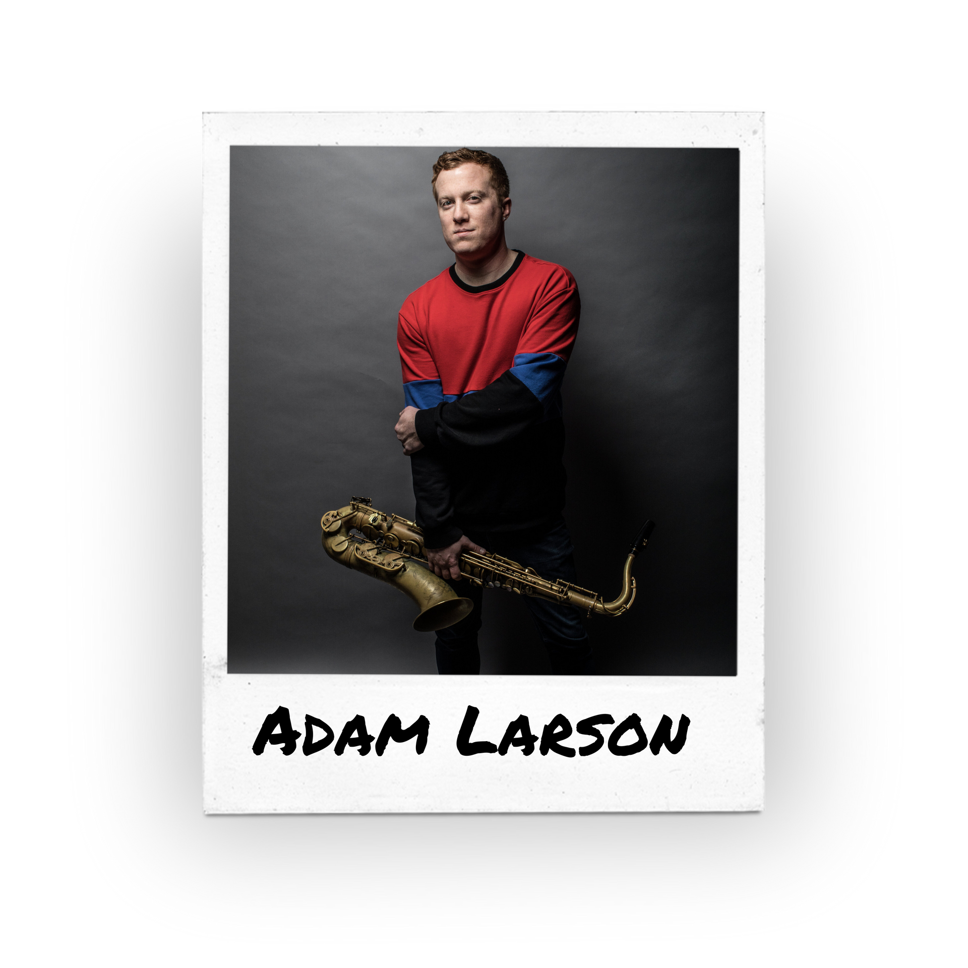 man standing in a red shirt holding a musical instrument