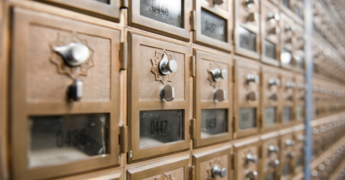 mailboxes with locks and in a row along a wall