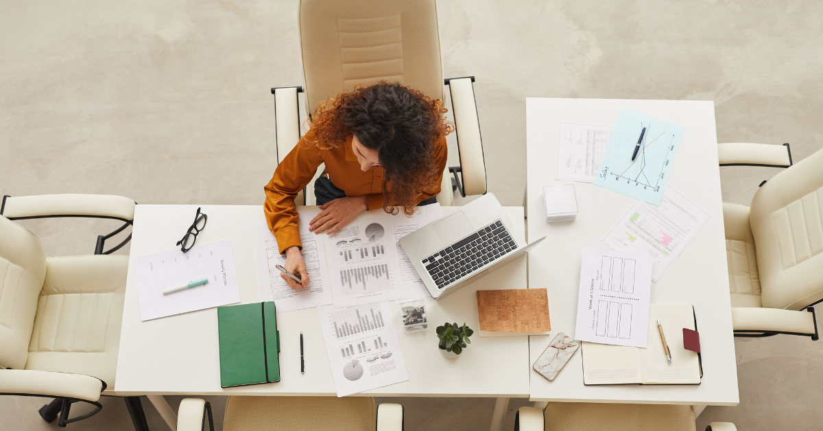 woman working at a desk inside an office space