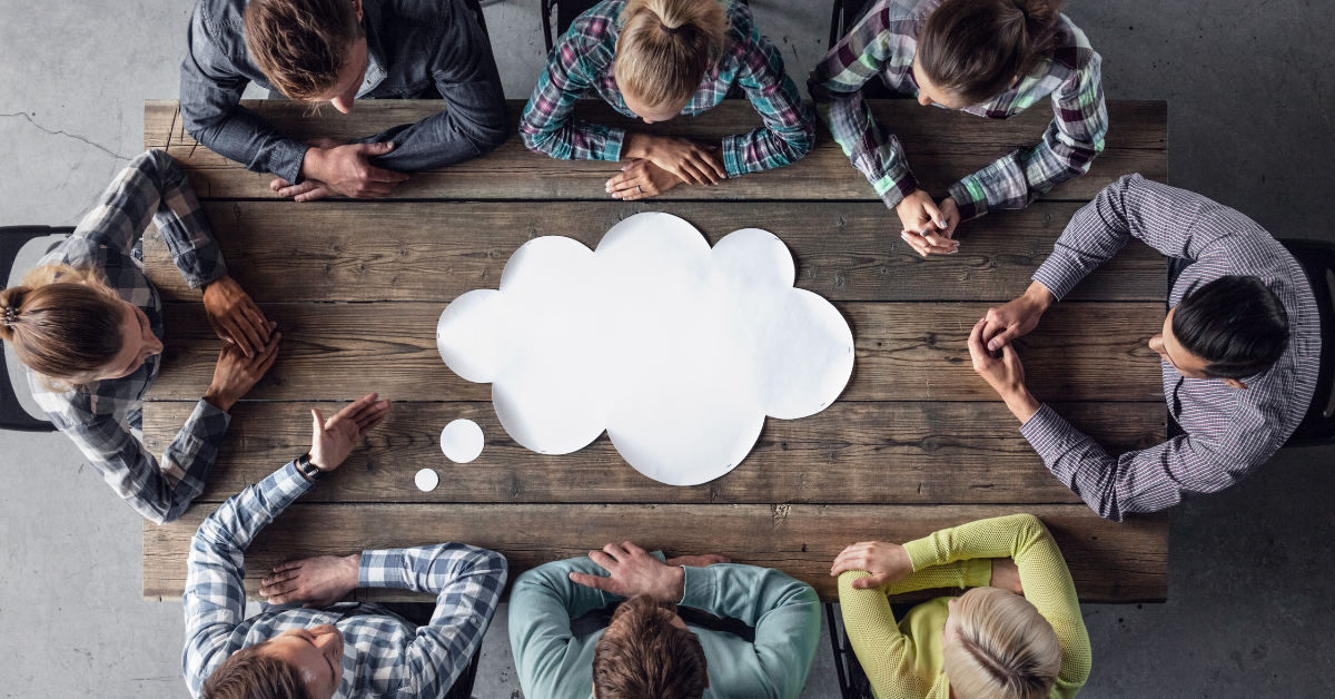 Team gathered around a shared table brainstorming new ideas during a strategy session.