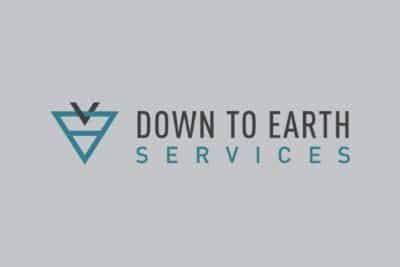 A logo for down to earth services with a triangle and a bird.