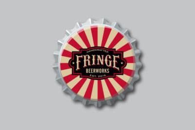 A bottle cap with fringe beerworks written on it