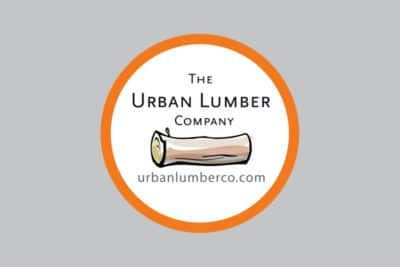 A logo for the urban lumber company shows a log in a circle.