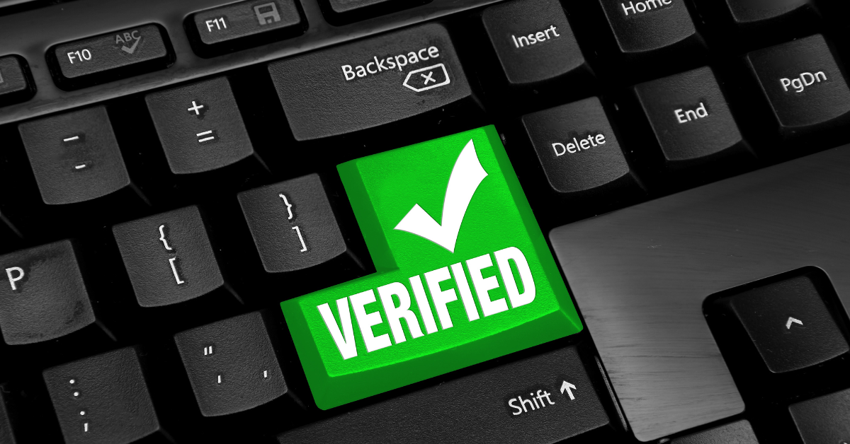 A green keyboard key labeled verified, representing the Google Business Profile verification support offered at Bridge Space in Lee’s Summit.