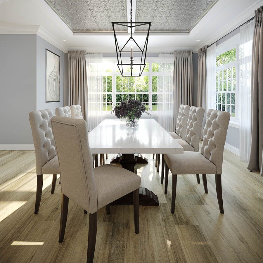 a dining room table with a vase of flowers on it