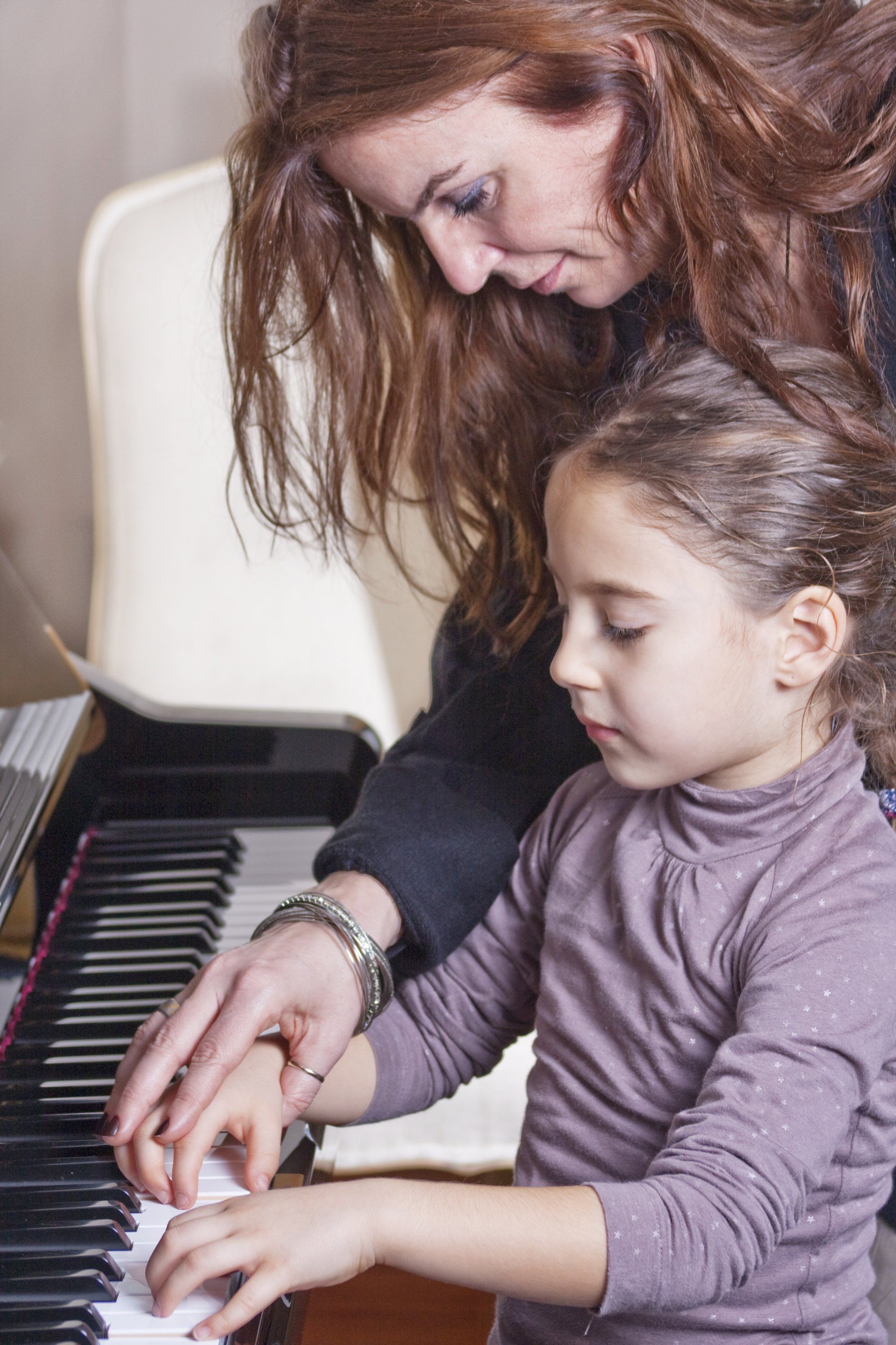 pianist and her student during lesson