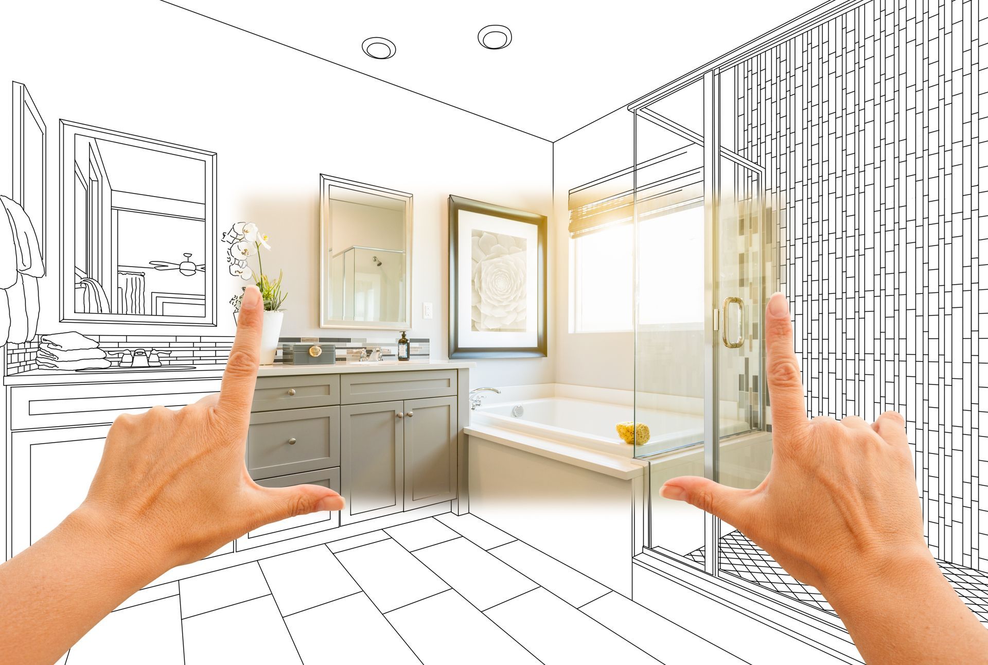Hands framing a bathroom design blending sketch outline with finished interior. Hands framing a bathroom design blending sketch outline with finished interior.