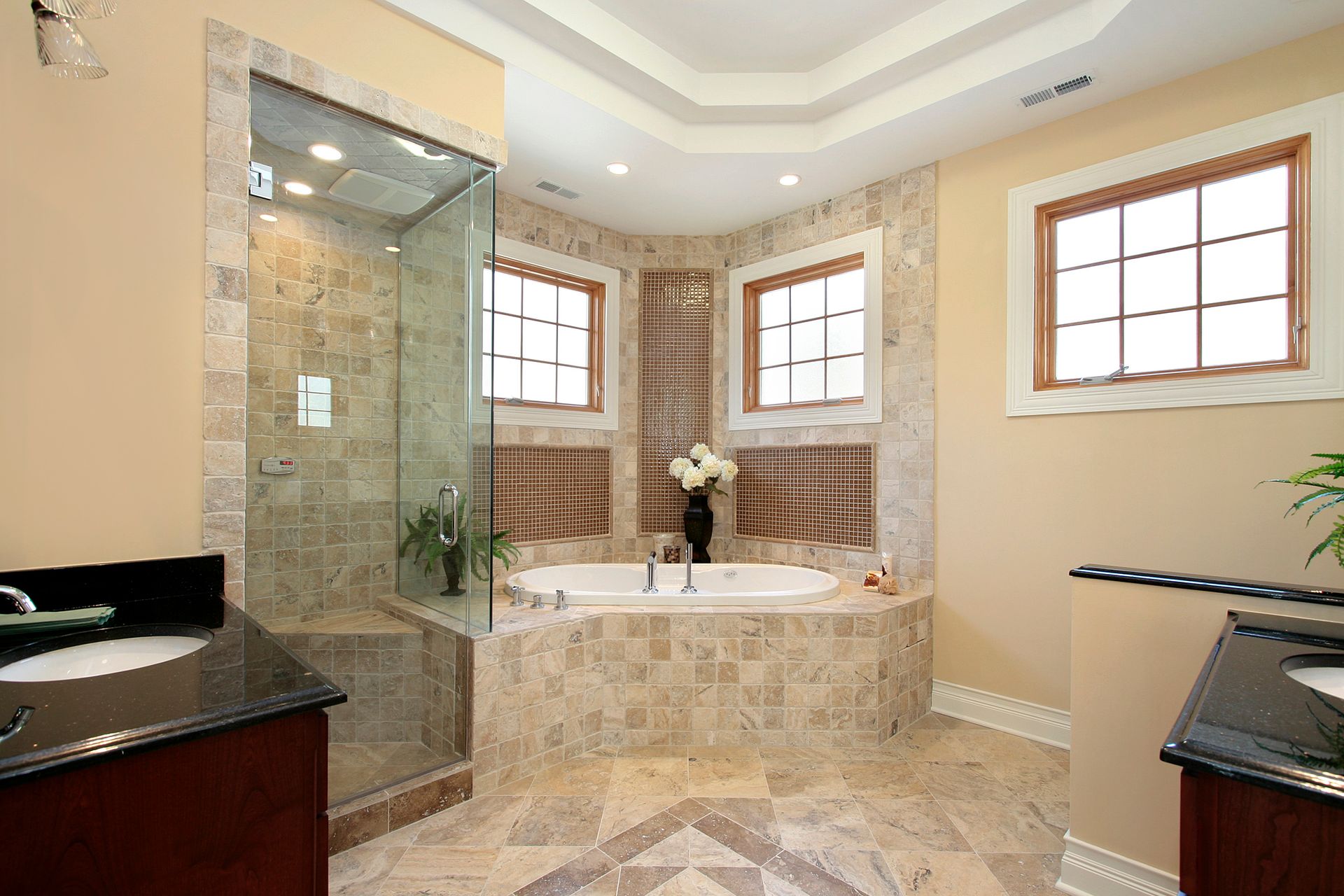 Modern bathroom with glass shower enclosure.