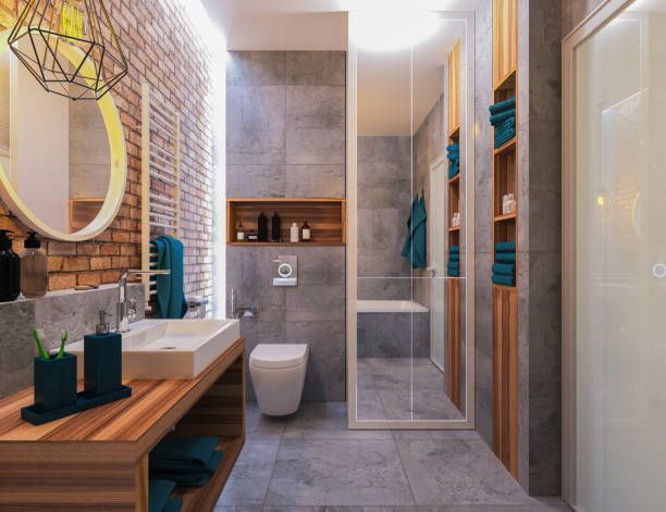 Modern bathroom design with glass shower, floating vanity, brick accent wall and wood shelving units.