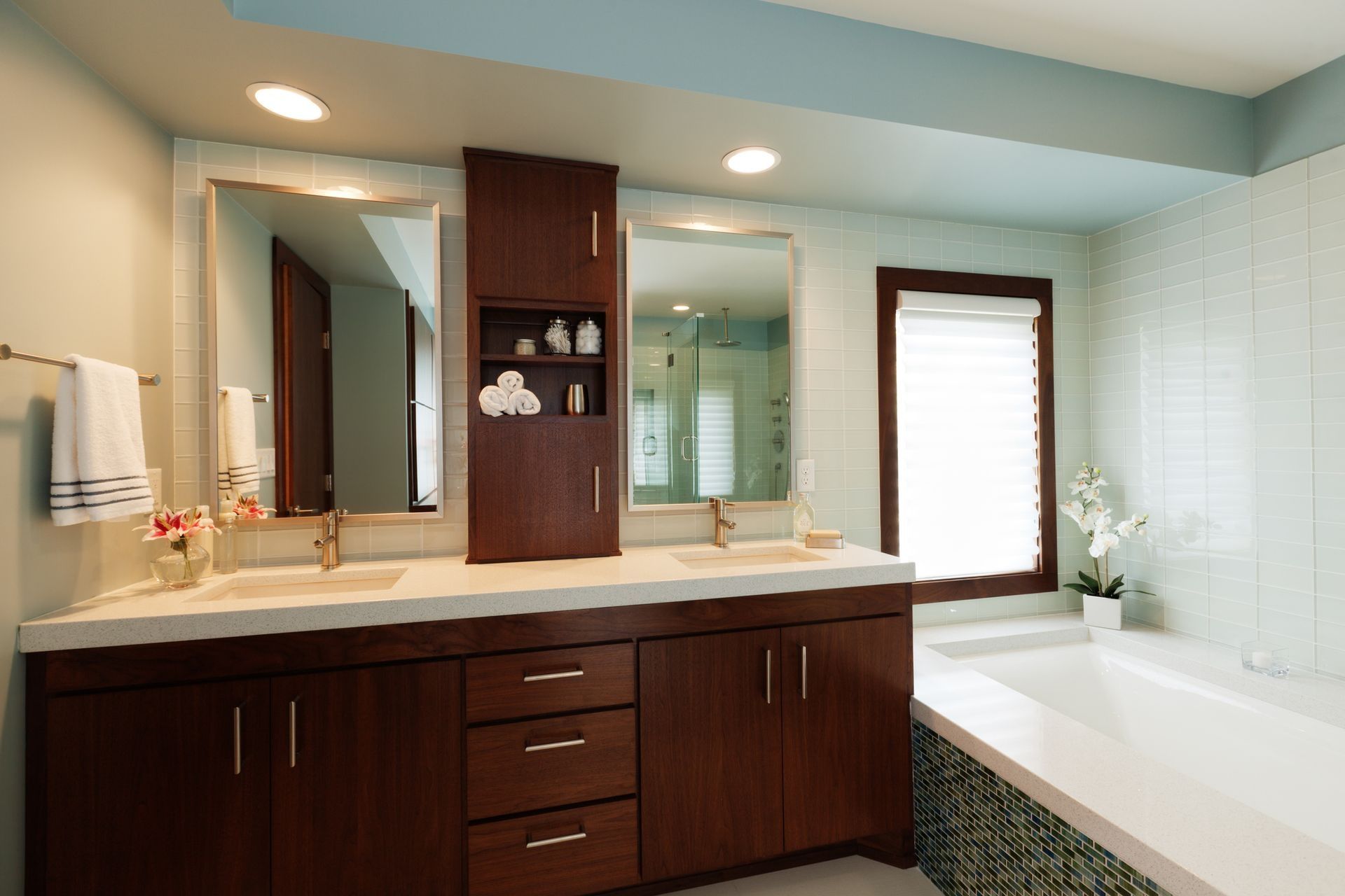 A bathroom with two sinks and a bathtub A bathroom with two sinks and a bathtub