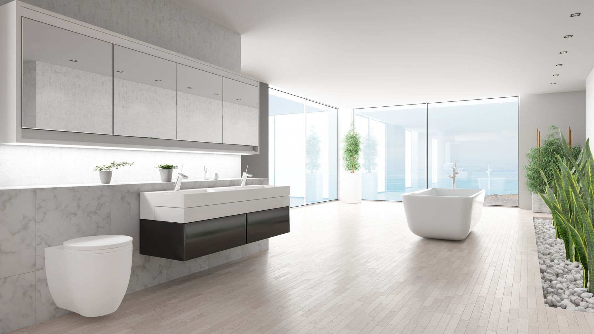 A bathroom with two sinks , two mirrors and a walk in shower. A bathroom with a large tub and a ottoman in it.