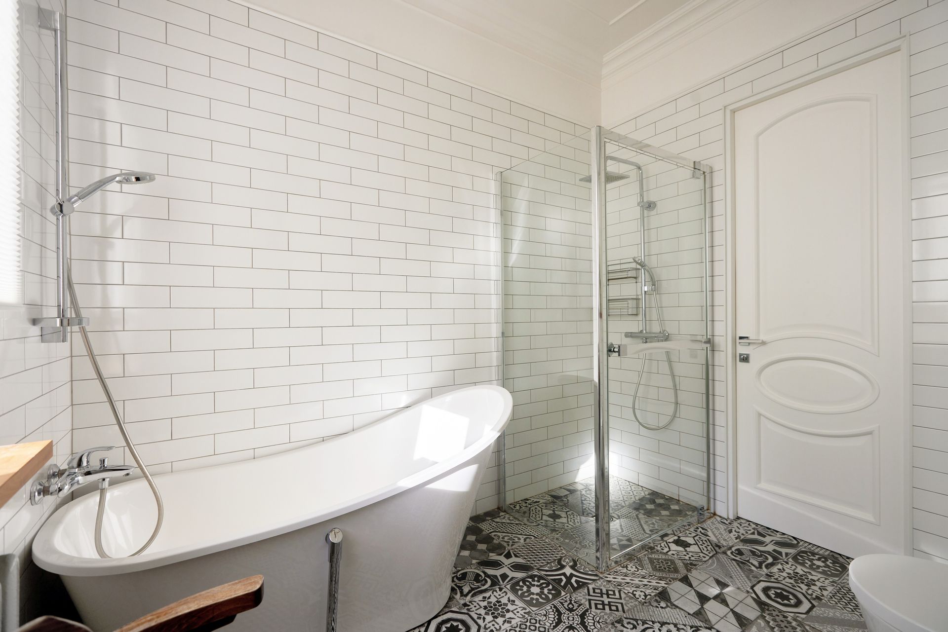 Modern bathroom with glass shower and tub setup ideal for tub to shower conversion project.