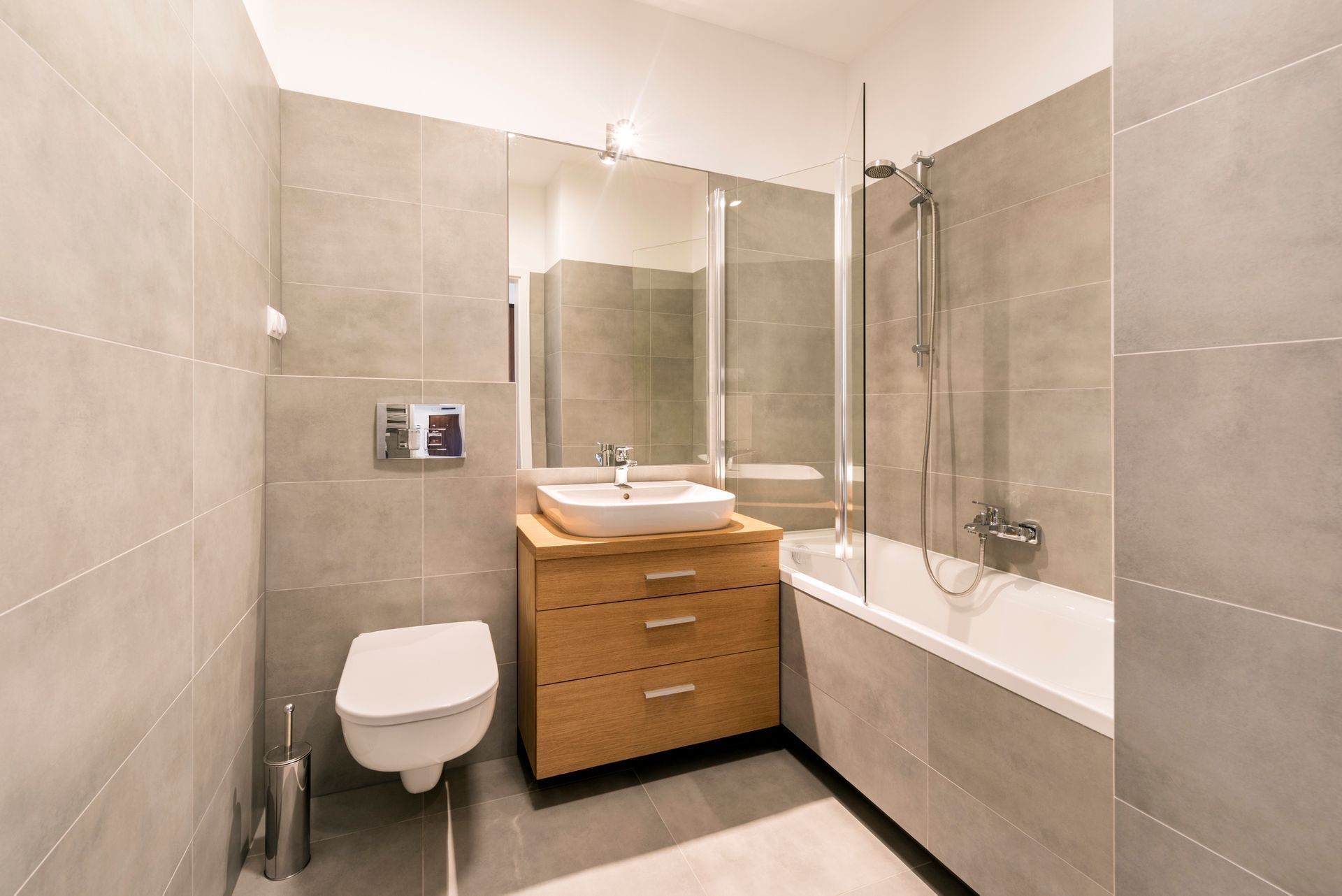 A bathroom with a toilet , sink , and bathtub.