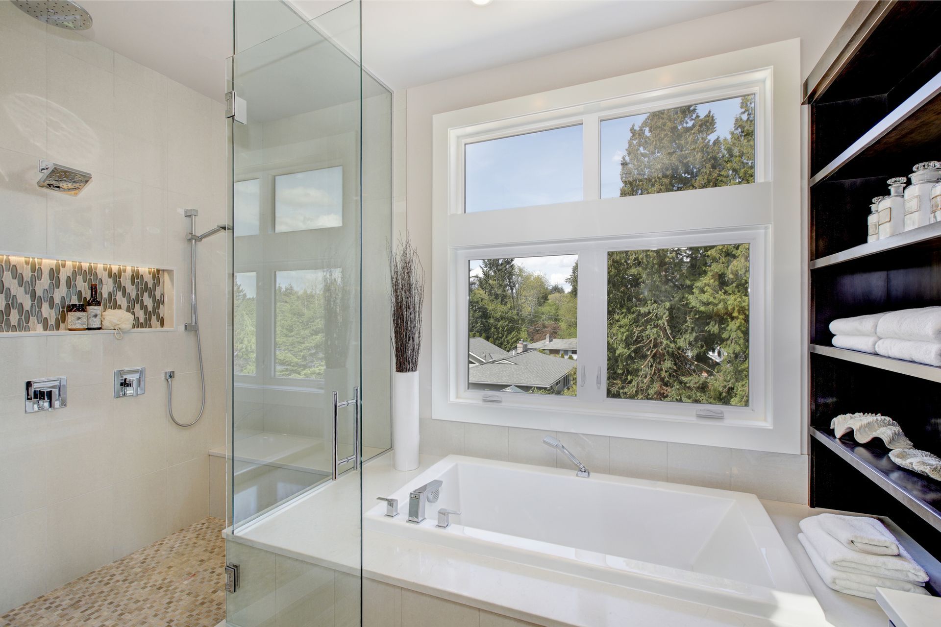 A luxurious master bathroom featuring a walk-in tub, with a perfect window view.