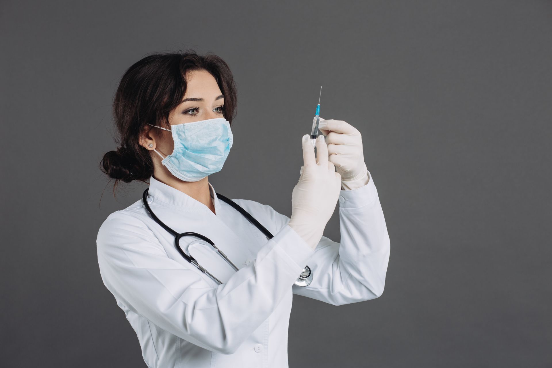 A weight loss doctor holds an FDA-approved injection for weight management.