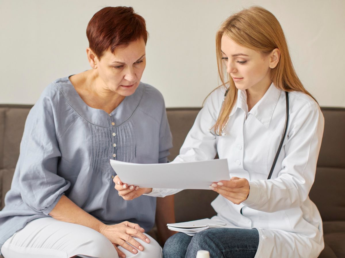 A doctor explaining the results of a well women’s exam to a patient