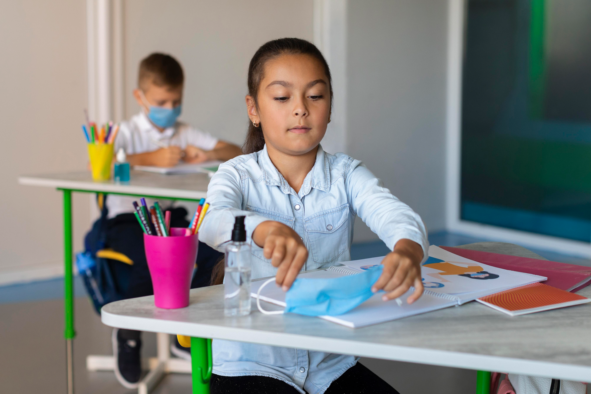 Two children following their parents’ tips to stay healthy in school