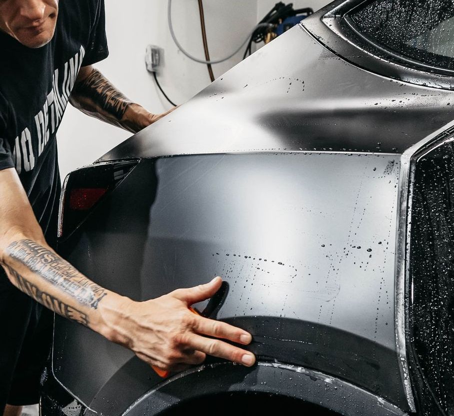 The interior of a tesla model 3 with white seats