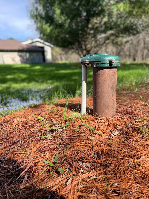 Technician performing well water testing at residential property in Arizona