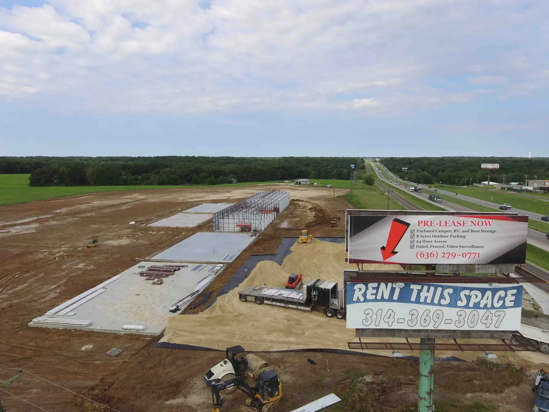 An aerial view of a construction site with a sign that says `` rent this space ''.