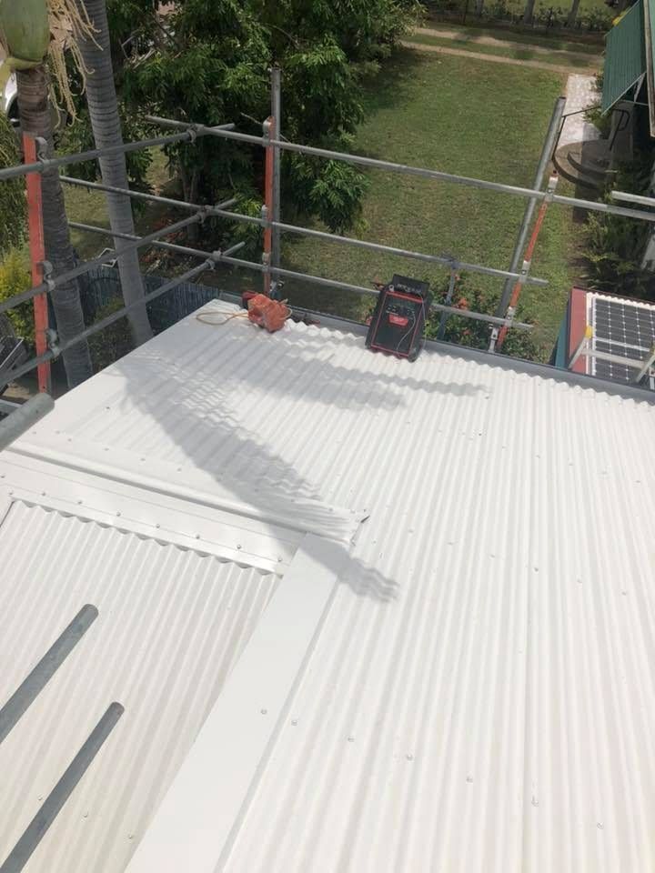 View From Atop a Metal Roof With Guardrails, Tools, and a Surrounding Grassy Area — MJD Roofing Sunshine Coast in Cooroy, QLD