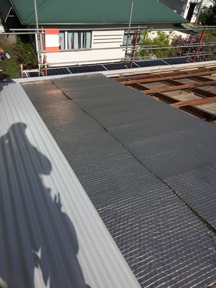 Construction of a Roof, With Gray Corrugated Panels, Insulation — MJD Roofing Sunshine Coast in Cooroy, QLD