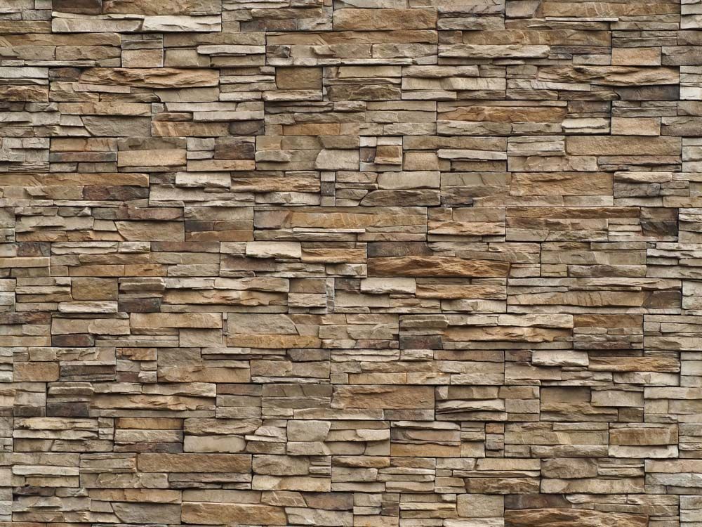 Tan and Brown Stone Wall, Constructed From Irregularly Shaped Rectangular Pieces — MJD Roofing Sunshine Coast in Cooroy, QLD