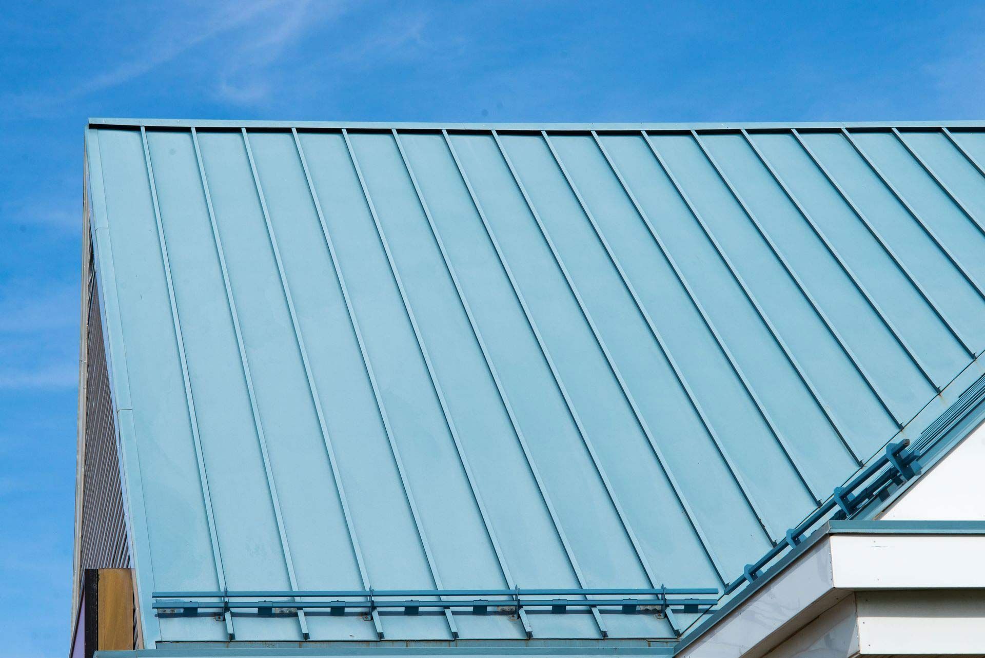 Blue Metal Roof Against a Clear Blue Sky — MJD Roofing Sunshine Coast in Cooroy, QLD