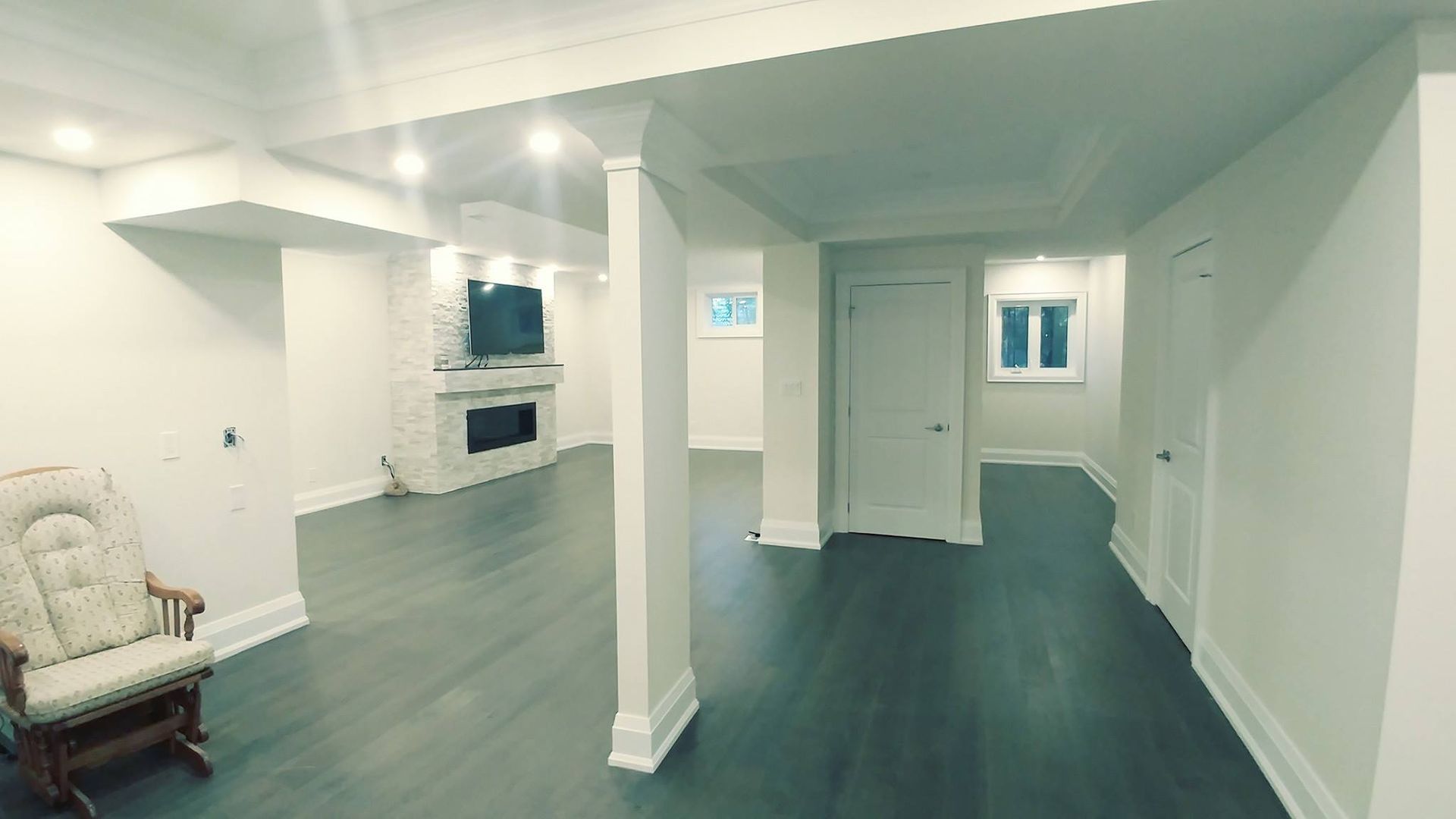 There is a rocking chair in the middle of the room.