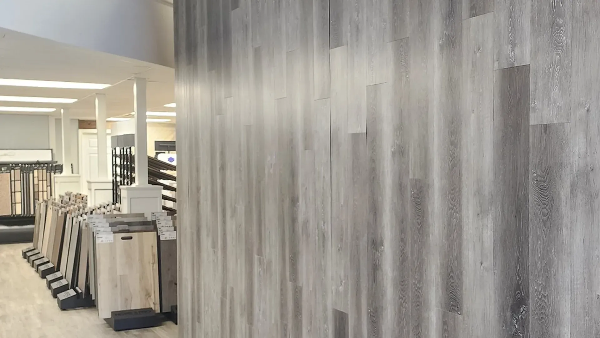 A wooden wall in a store with a lot of wooden floors