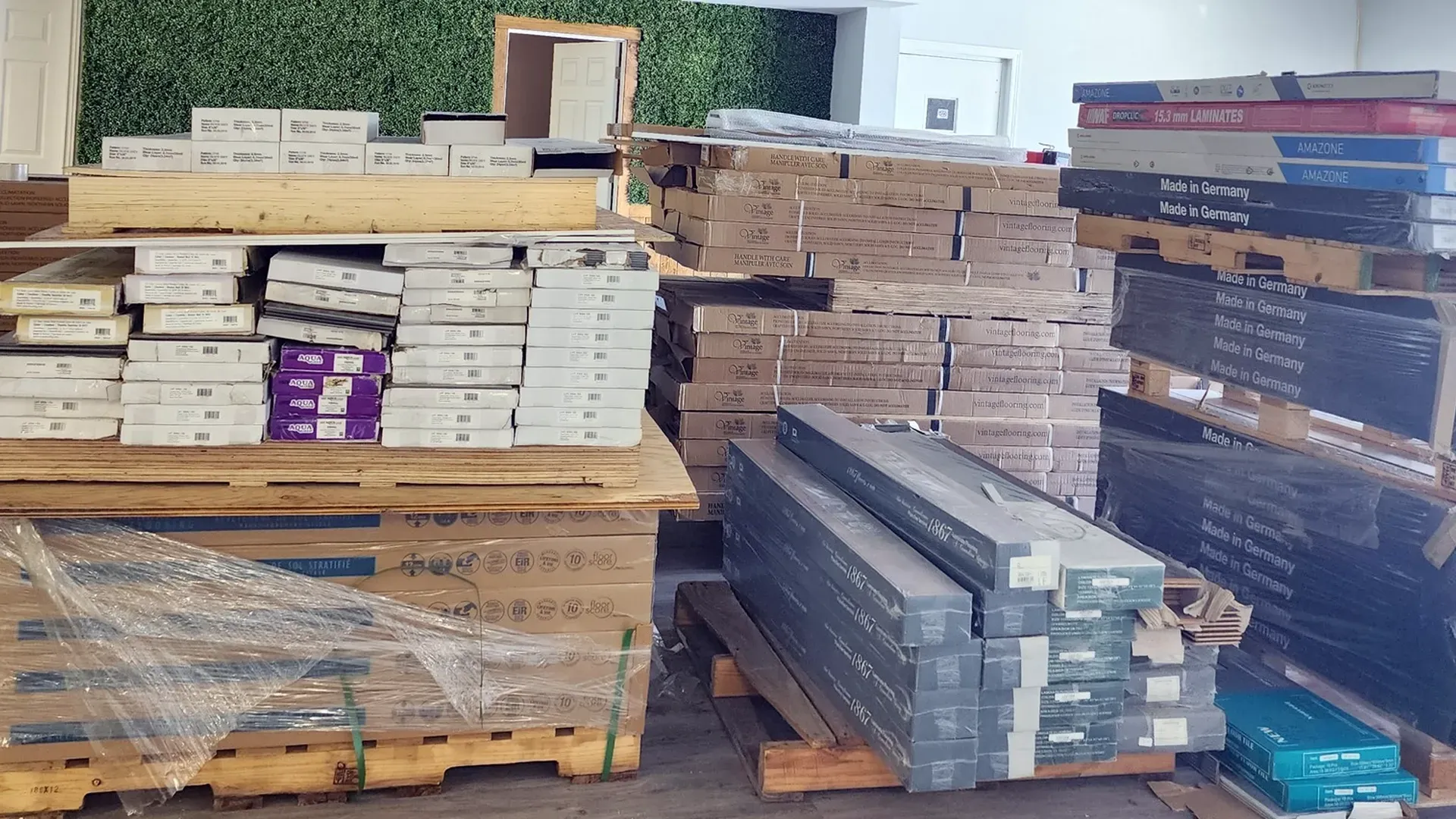 A bunch of wooden pallets are stacked on top of each other