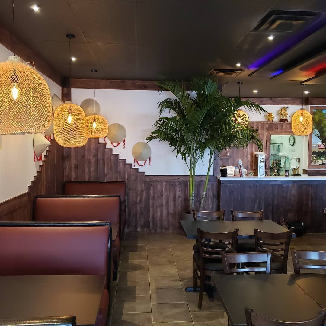 The inside of a restaurant with tables and booths