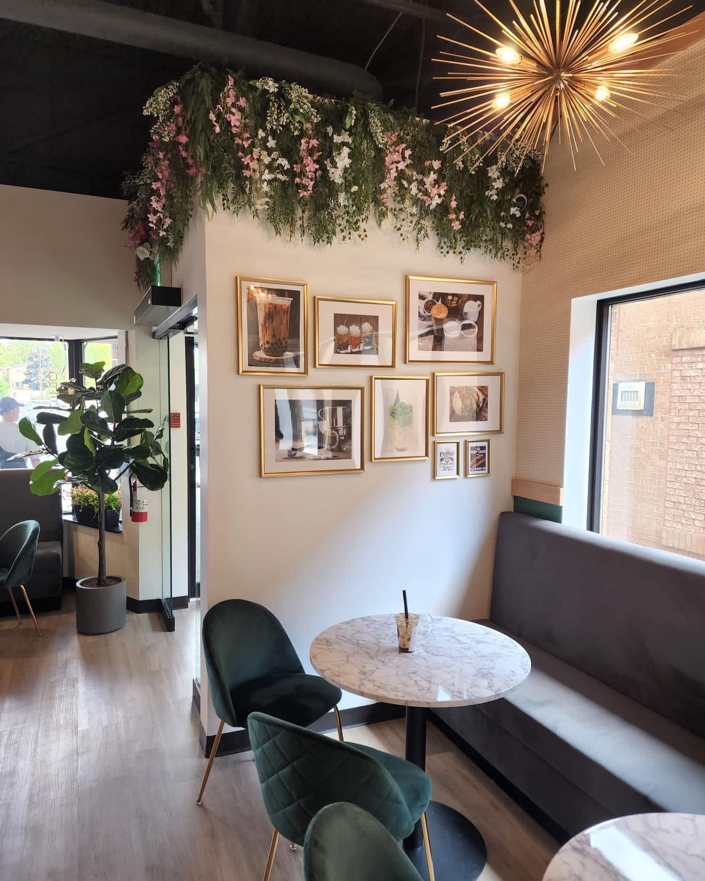 A room with tables and chairs and pictures on the wall