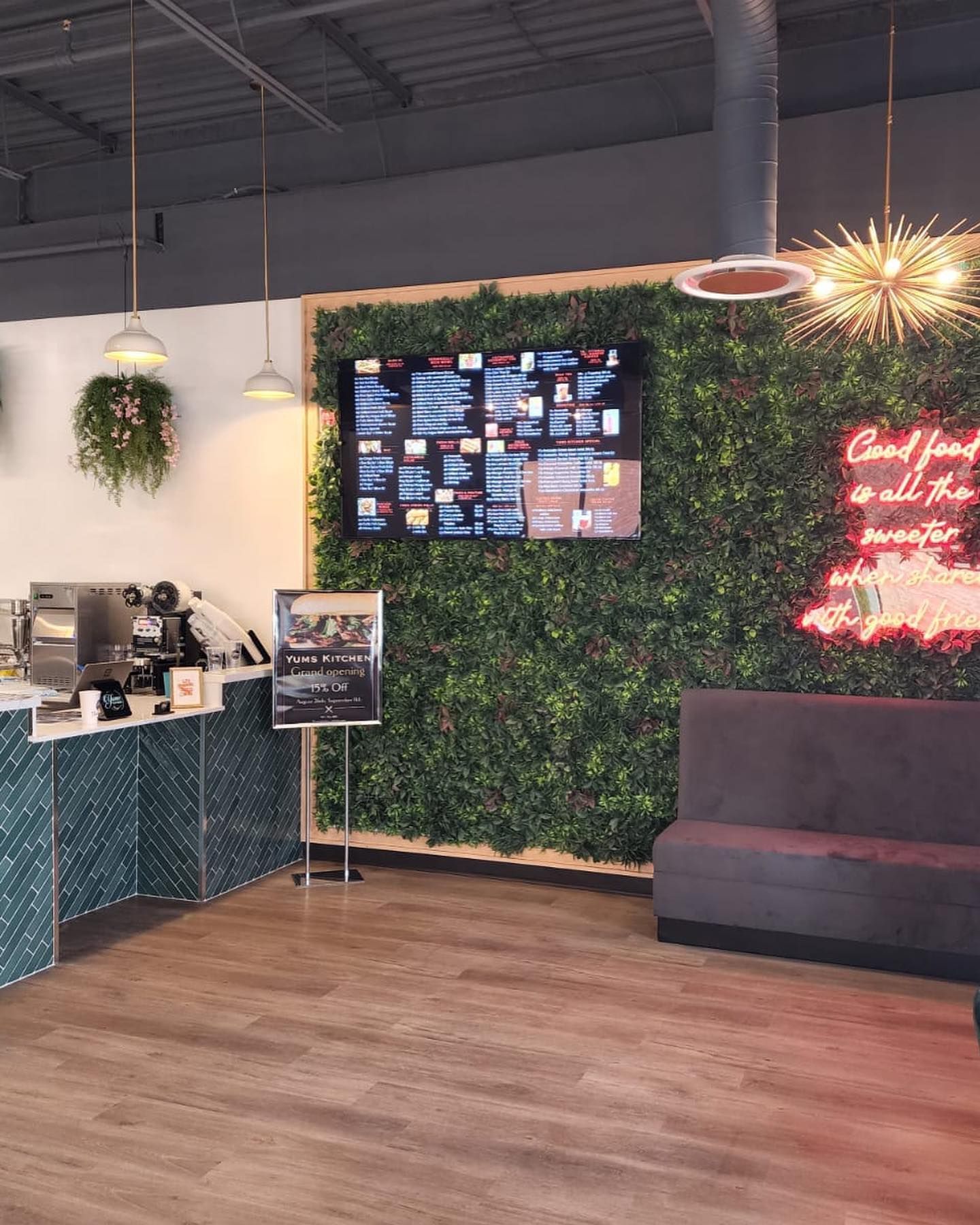 A restaurant with a neon sign that says good food