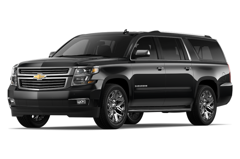 Black Chevrolet Suburban SUV with chrome wheels.