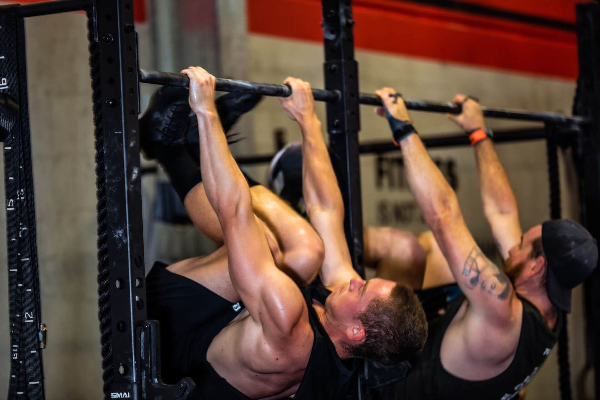 Image of a man crossfit training pushing heavy equipment
